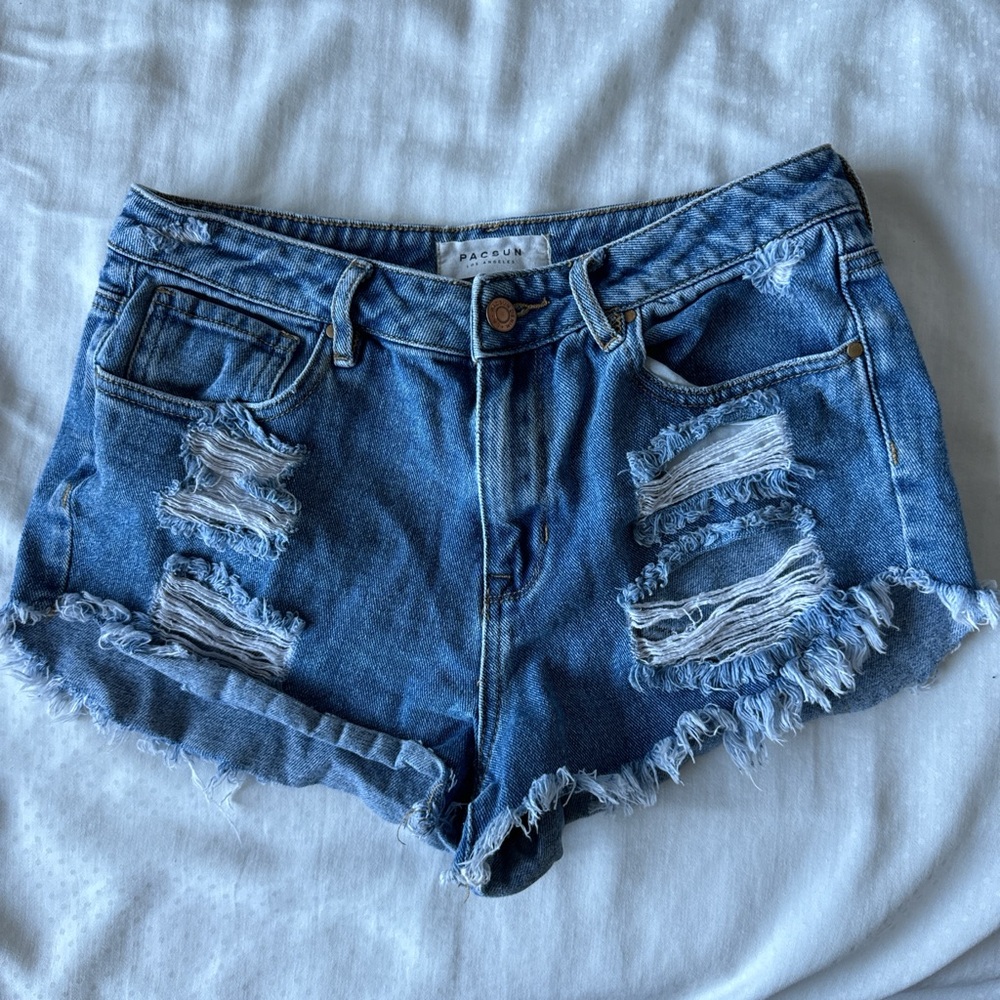 high rise blue festival denim shorts with rips
